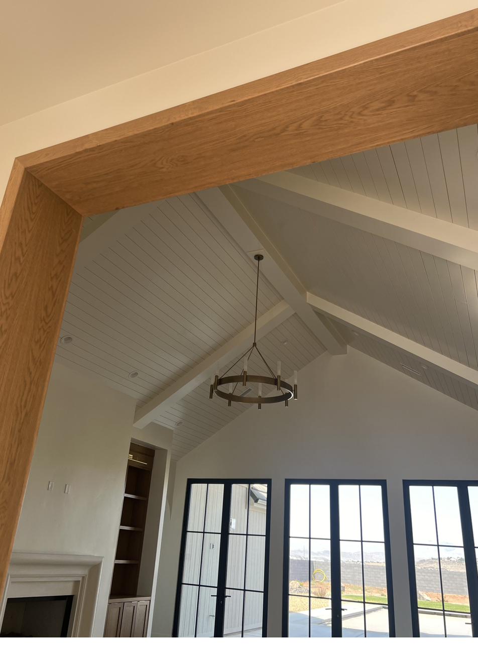 Vaulted wood-beam great room painted by Super Painting